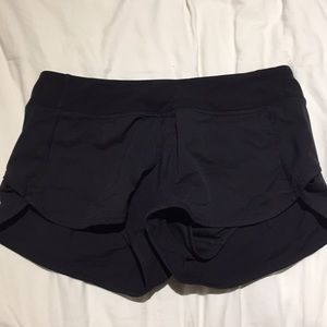 Lululemon kids (Ivivva) running shorts.